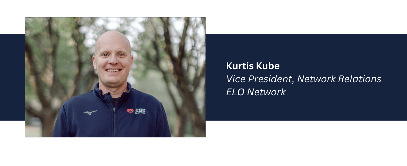 Kurtis Kube VP of Network Relations for ELO smiles in front of a blurry natural setting background